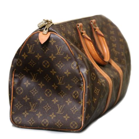 louis vuitton vintage handbags clip button|Louis Vuitton vintage bag website.